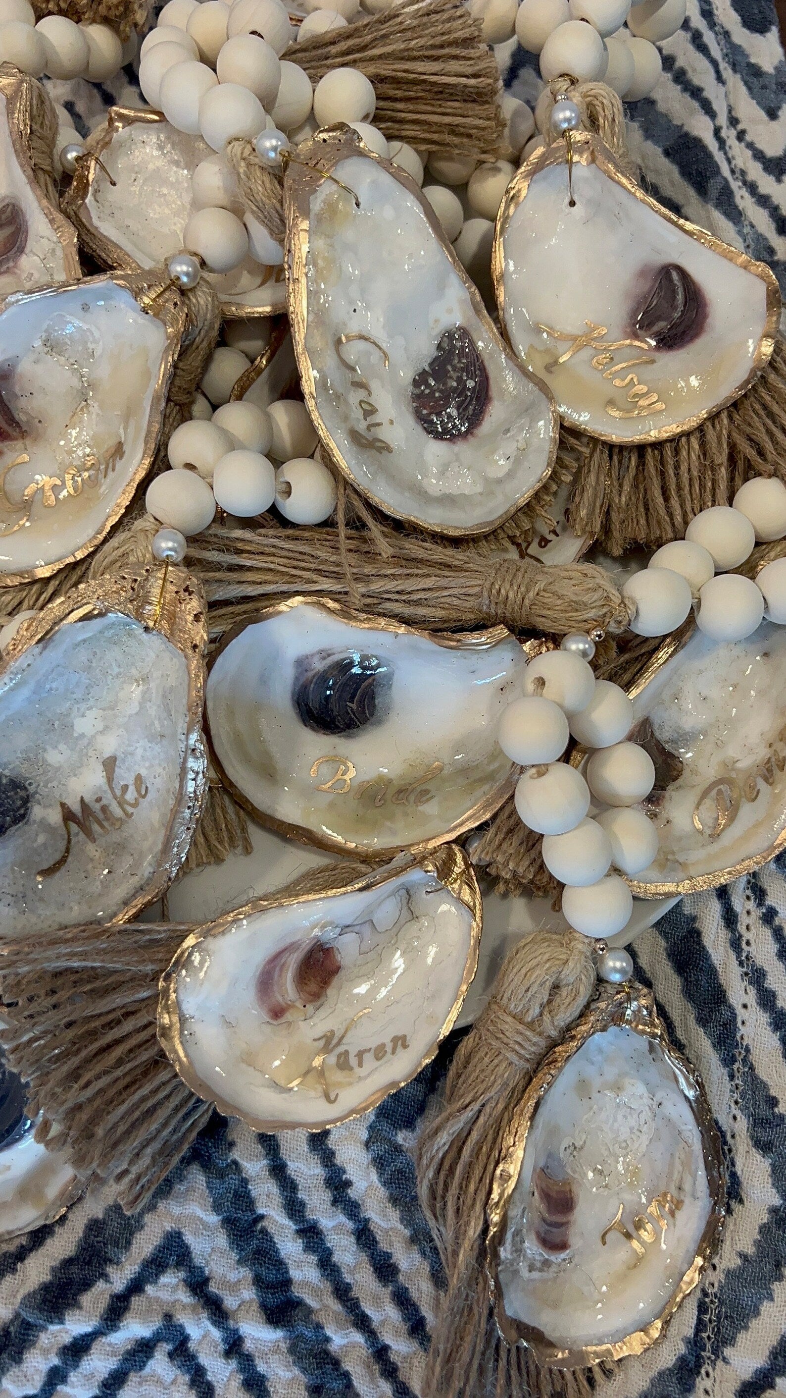 Coastal wedding favors. Gilded napkin ring. Oyster napkin ring. Oyster shell wedding favor.