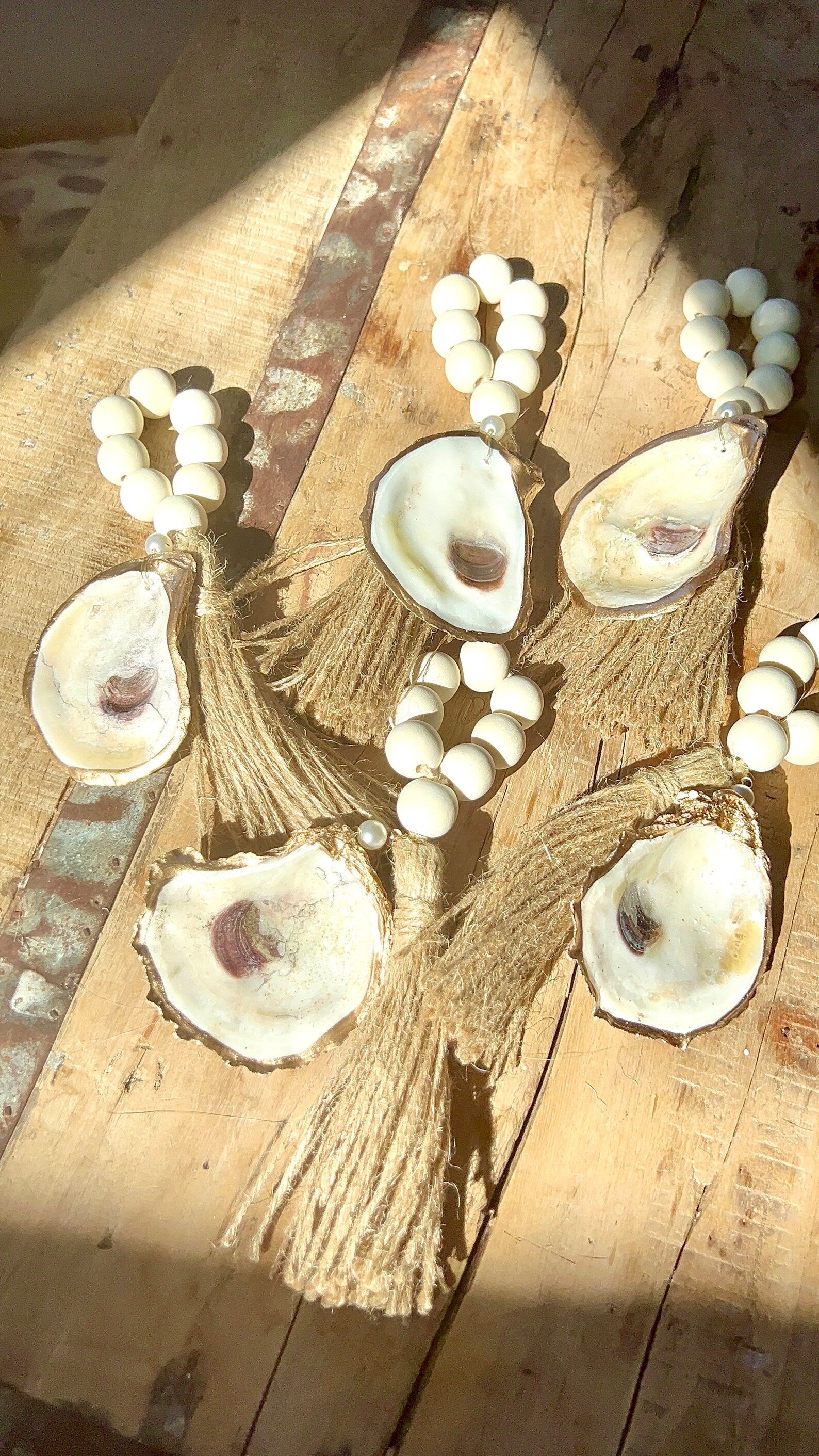 Coastal wedding favors. Gilded napkin ring. Oyster napkin ring. Oyster shell wedding favor.