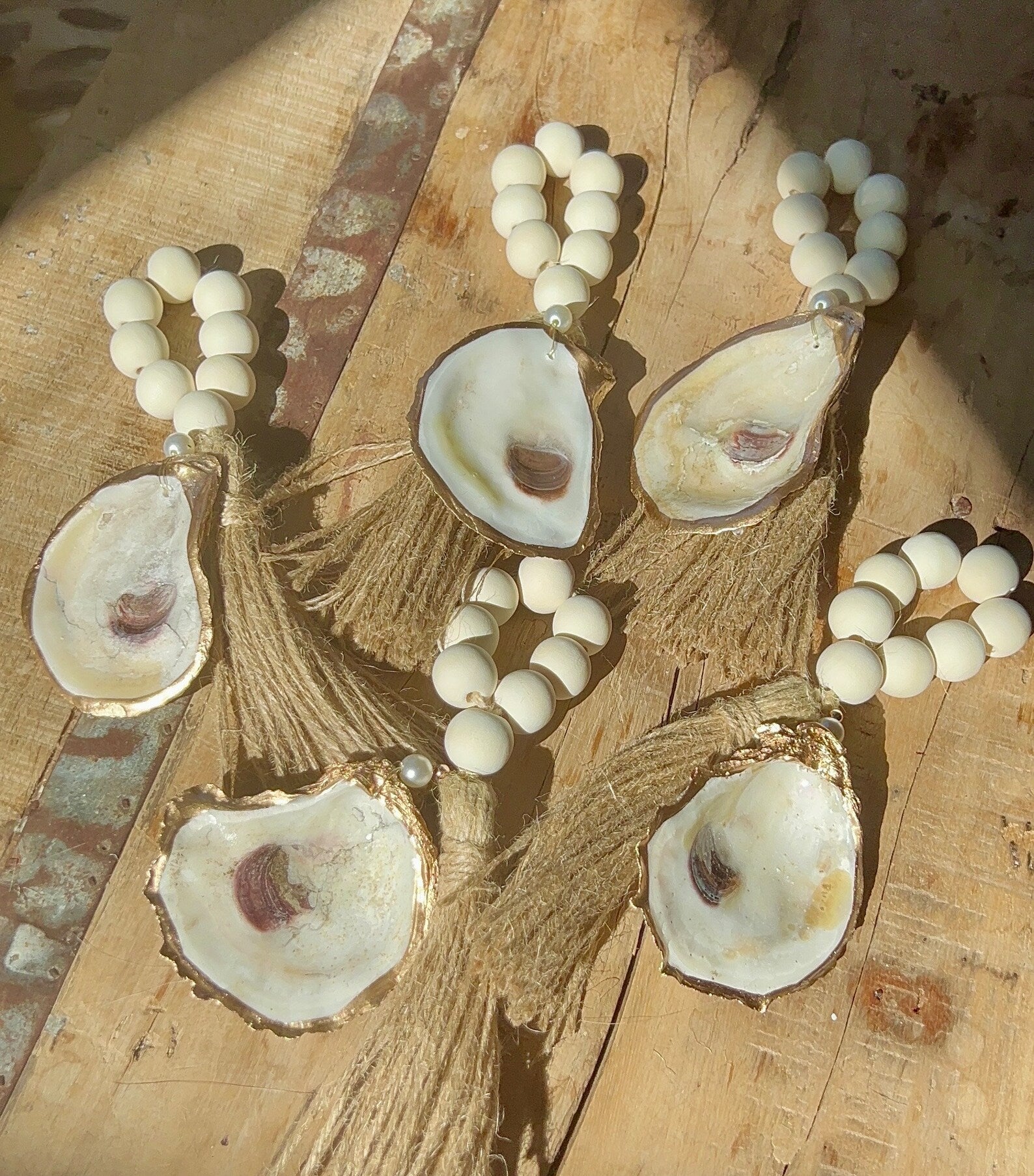 Coastal wedding favors. Gilded napkin ring. Oyster napkin ring. Oyster shell wedding favor.